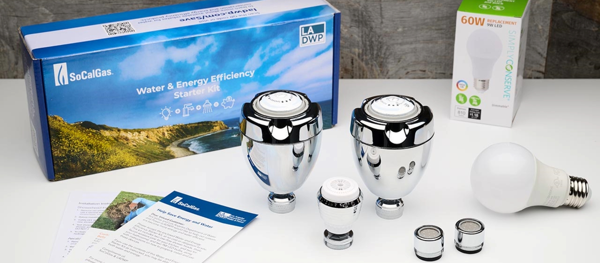 Image shows energy efficiency kit, including lightbulbs and pamphlets