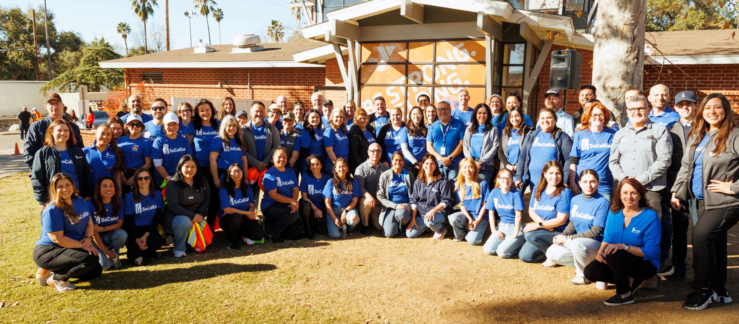 SoCalGas employees posing for photo in front of YMCA facility